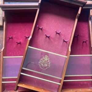 Two Harry Potter wand display cases